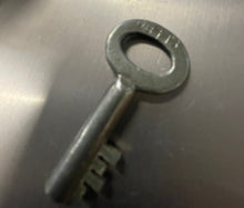 Load image into Gallery viewer, close up of vintage footlocker key OB113
