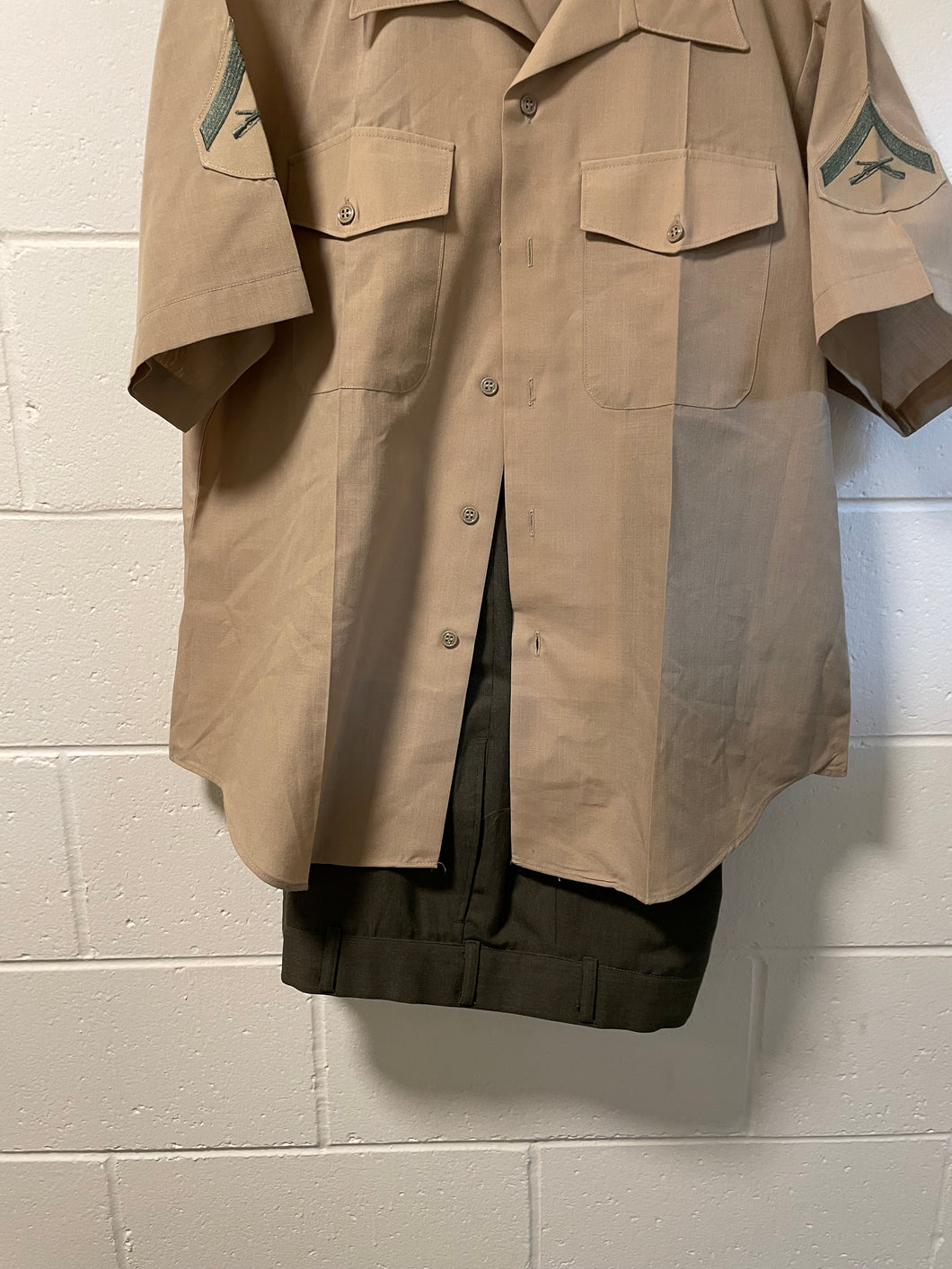 FRONT VIEW OF MARINE CORPS UNIFORM SHIRT AND PANTS