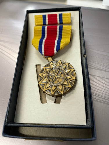 FRONT OF NATIONAL GUARD MEDAL IN BOX WITH RIBBON