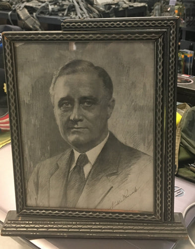 front facing picture of franklin d Roosevelt in a gray frame 
