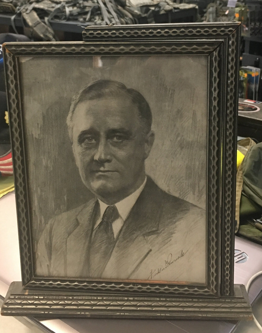 front facing picture of franklin d Roosevelt in a gray frame 