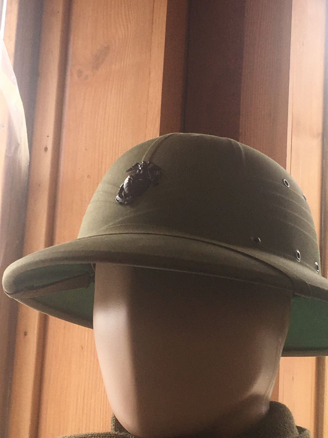 Green ww2 pith helmet front view on mannequin